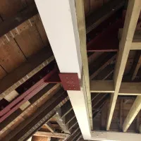 An image of some metal I beams we fabricated being used in a building