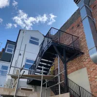 An image of a metal fire escape staircase we fabricated